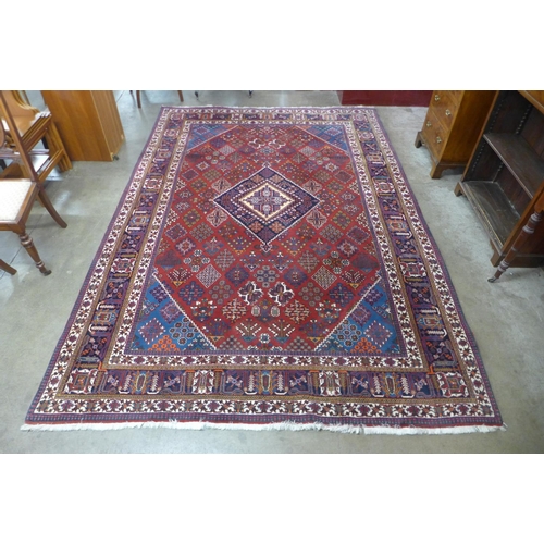 110 - A large red ground rug