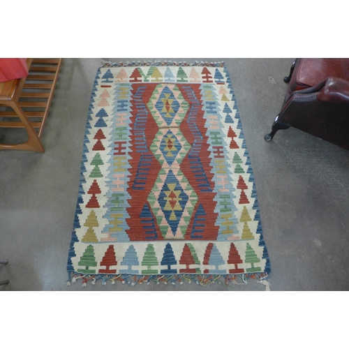 112 - A Turkish hand made patterned rug, 150 x 109cm