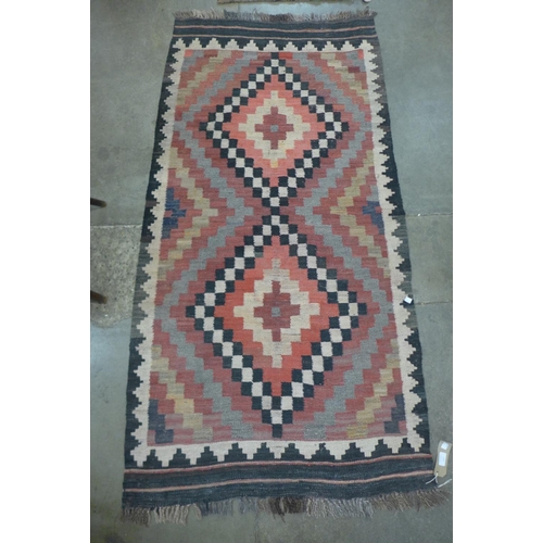 113 - A Kilim geometric patterned rug, 195 x 94cm