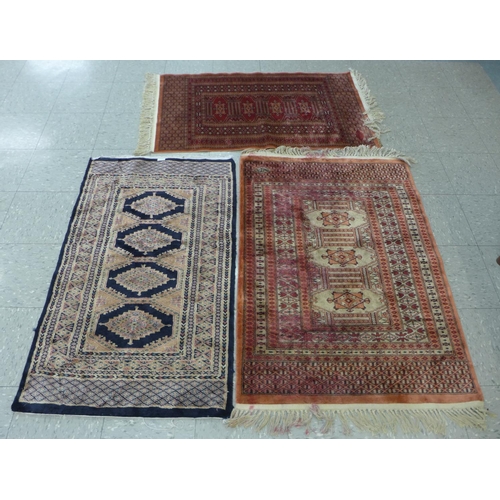 115 - Three assorted rugs