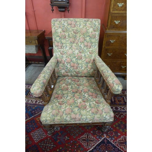 86 - A Victorian walnut and upholstered armchair