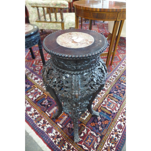 89 - A 19th Century Chinese carved rosewood and marble topped jardiniere stand