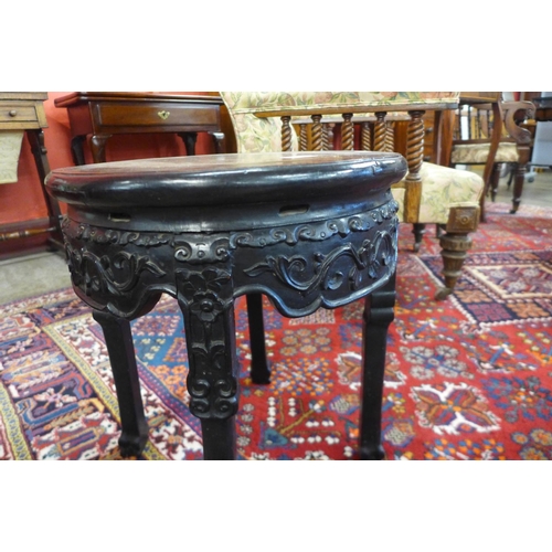 90 - A 19th Century Chinese carved rosewood and marble topped jardiniere stand