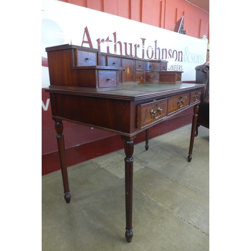 92 - An inlaid mahogany Carlton House style desk