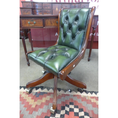 93 - A beech and green leather desk chair