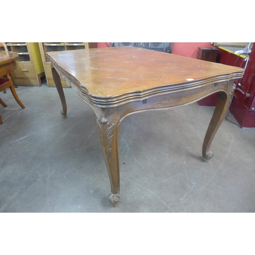 95 - A French oak parquetry top draw-leaf dining table