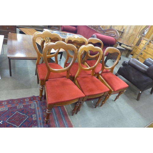 97 - A set of four Victorian walnut balloon back dining chairs and another pair similar