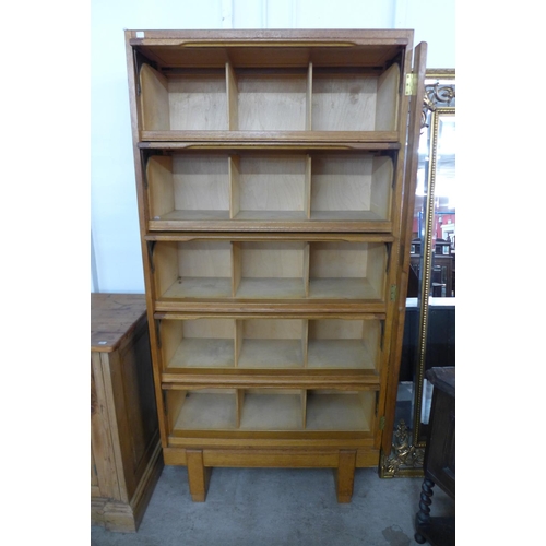 161 - A mid 20th century Staverton oak fitted five door cabinet