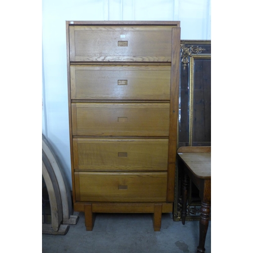 161 - A mid 20th century Staverton oak fitted five door cabinet