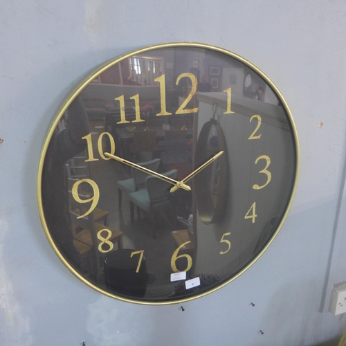 1458 - A gilt cased wall clock with black dial (2017824)   #