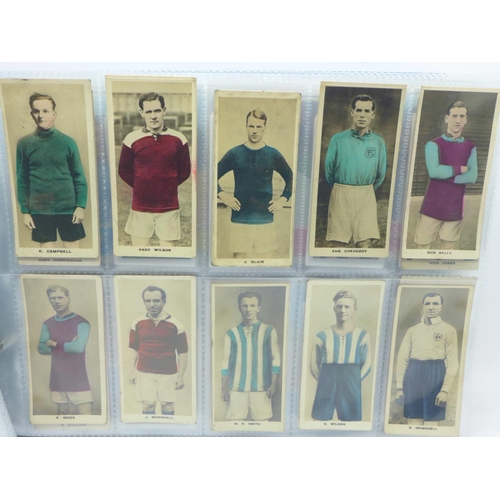 660 - An album of football cigarette and trade cards in sets and part sets