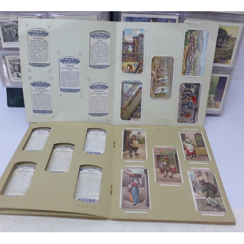 680 - An album of fourteen complete sets of cigarette cards, an album of nine sets of trade cards and two ... 