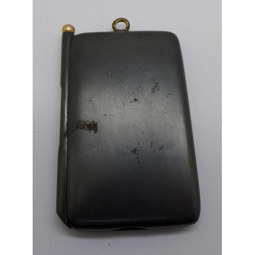 759 - A gun metal notebook case with pencil, set with turquoise and with plated mounts