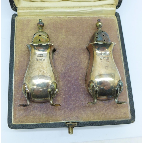 773 - A pair of silver pepperettes, in case, 53g
