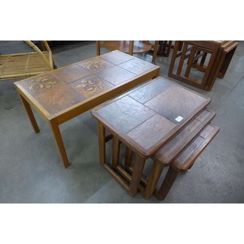 104 - A teak and tiled top coffee table and a nest of tables