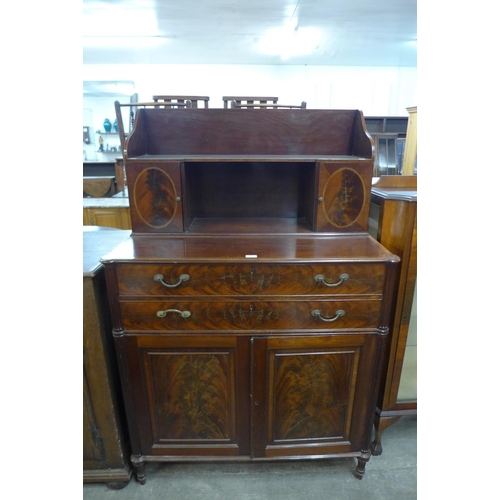 148 - A Regency style inlaid mahogany side cabinet