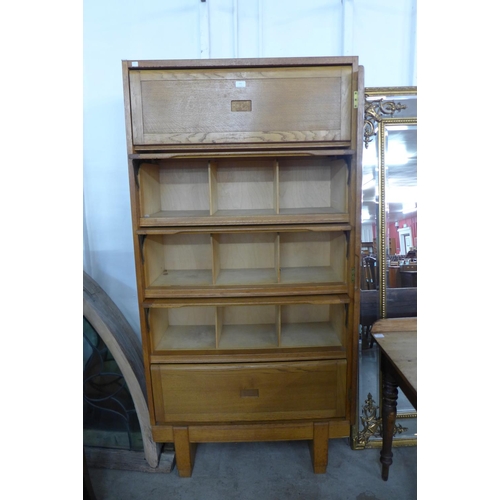 161 - A mid 20th century Staverton oak fitted five door cabinet