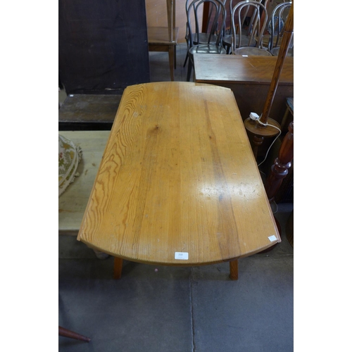 210 - An Ercol pine drop-leaf table