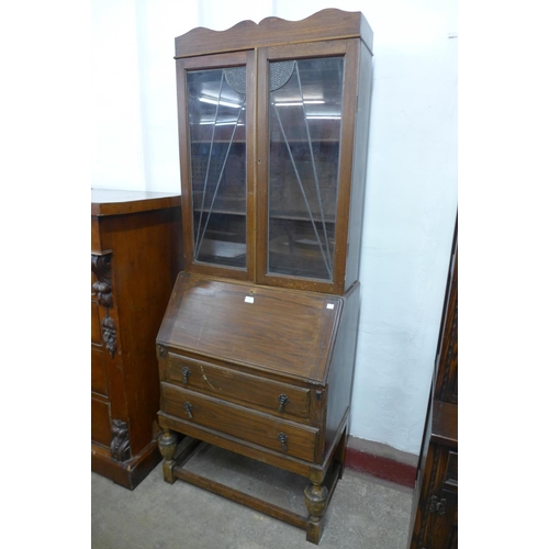 237 - An oak bureau bookcase