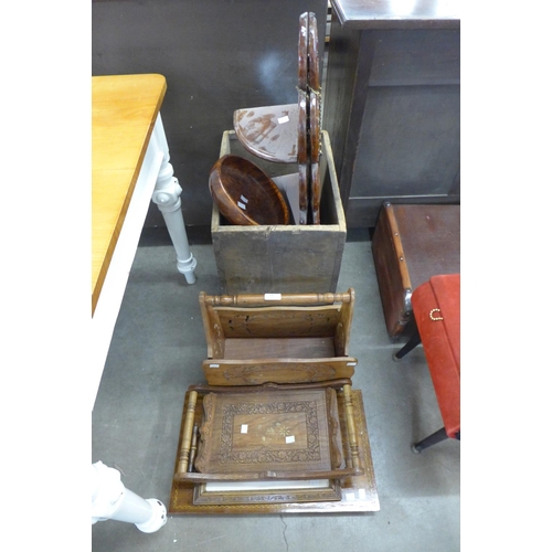 245 - A carved wooden folding wall shelf, magazine rack, two trays, two inlaid plaques and a fruit bowl