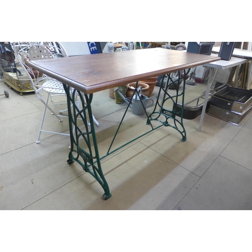 292 - A cast alloy based garden table