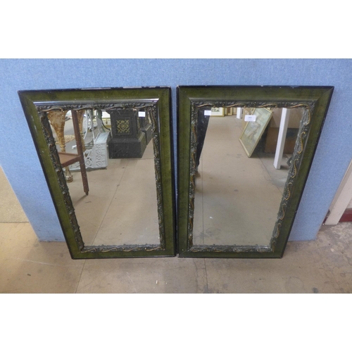 302 - A pair of green and parcel gilt framed mirrors