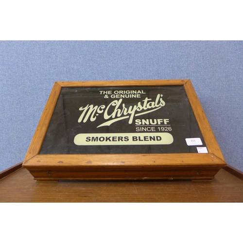 311 - A small display case, bearing McChrystal's Snuff inscription