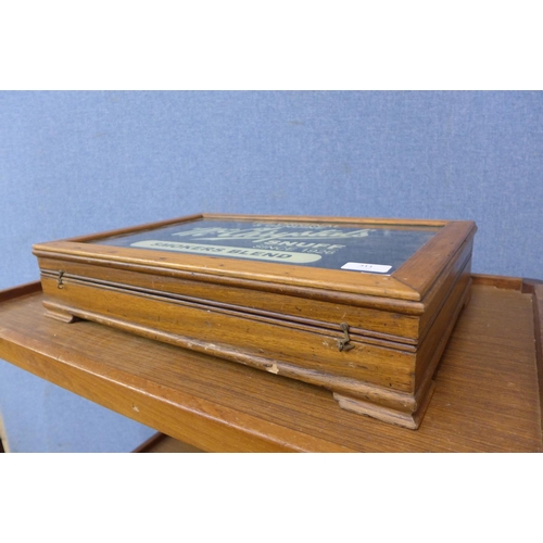 311 - A small display case, bearing McChrystal's Snuff inscription