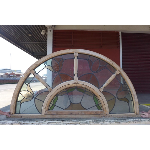 356 - A pair of Art Nouveau style arched stained glass windows