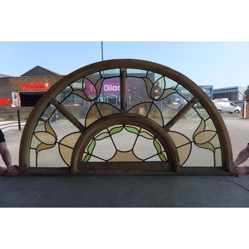 356 - A pair of Art Nouveau style arched stained glass windows