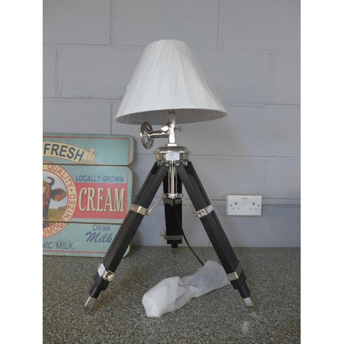 1674 - An industrial style tripod lamp