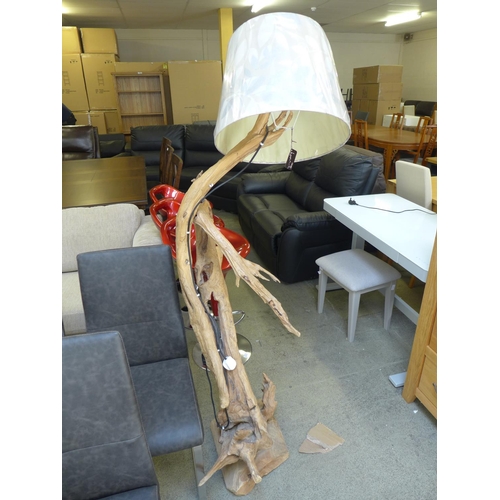 1788 - A solid teak floor standing tree lamp