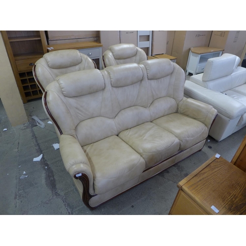 1710 - An Italian beige leather three piece suite