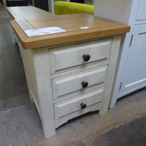 1592 - An oak and cream bedside chest.  -  *this lot is subject to vat