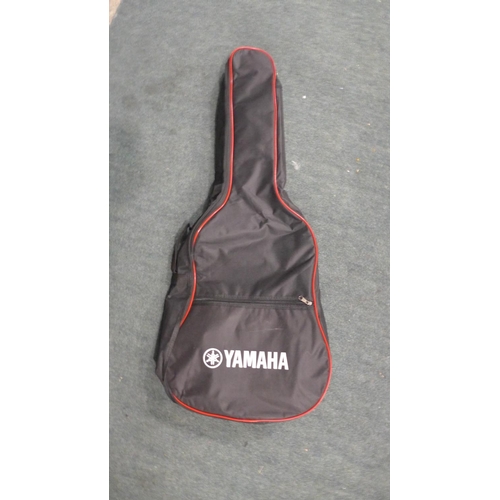 3414 - A Yamaha F310 Guitar stand and bag    (189-262) * This lot is subject to vat