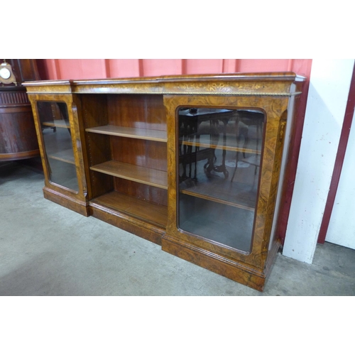 95 - A Victorian inlaid walnut and ormolu mounted breakfront bookcase