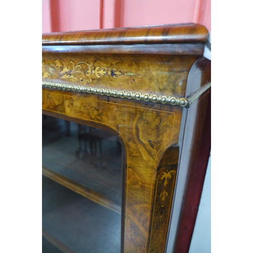 95 - A Victorian inlaid walnut and ormolu mounted breakfront bookcase