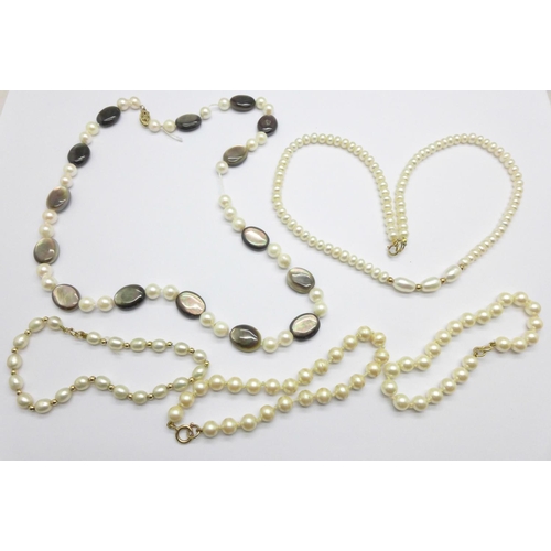 1087 - A cultured pearl necklace and three bracelets, all with 9ct gold fasteners, and one other pearl neck... 