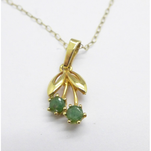 1098 - A 9ct gold and emerald pendant on 9ct gold chain, 1g