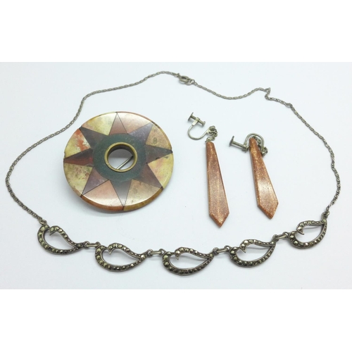 1099 - A silver and marcasite necklace, a Celtic agate brooch, a/f, and a pair of drop earrings