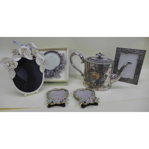 1107 - Photograph frames and a plated teapot