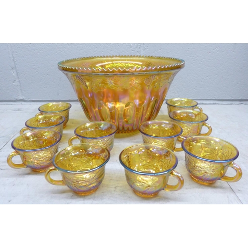 1116 - A Carnival glass punch bowl and ten glasses **PLEASE NOTE THIS LOT IS NOT ELIGIBLE FOR POSTING AND P... 