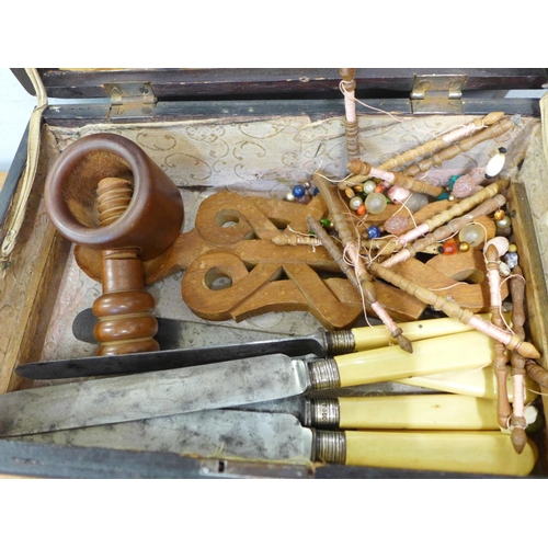 662 - A wooden box containing knives with silver ferrules and treen, etc.