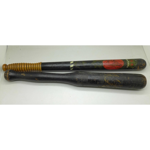 677 - Two Victorian painted police truncheons, one with crown and turned handle