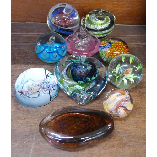 688 - Ten glass paperweights