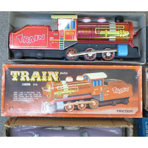 692 - Four boxed toys, Minister Delux Car, Train, long range clockwork Cabin Cruiser and Jumbo Jet