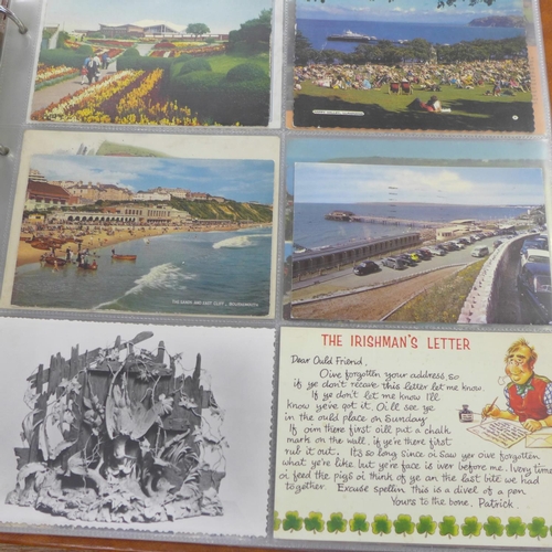 693 - A postcard album, 200 cards