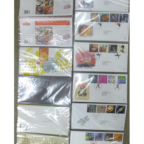 694 - A 1999 Millennium Series Collection, 12 presentation packs and 12 official first day covers in prese... 