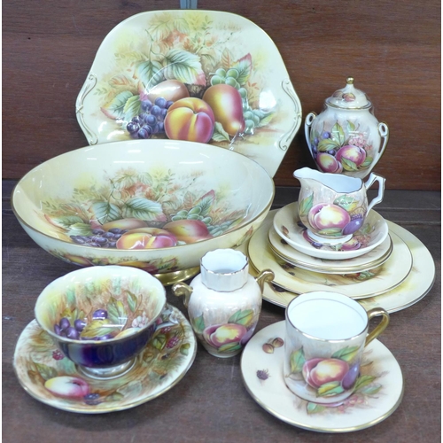 695 - A collection of Aynsley Orchard Gold china including a large bowl, lidded vase, sandwich plate, etc.... 