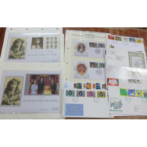 698 - A collection of covers;- The Queen Mother's 100th Birthday silver cover collection (4) on pages with... 